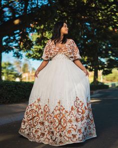 This Habesha dress is made of luxurious Menen fabric, known for its softness and durability. The dress features a gorgeous pattern of intricate Tilf embroidery, covering the entire dress from the neckline to the bottom. The Tilf embroidery adds a touch of elegance and sophistication to the dress, featuring delicate patterns and designs that are unique to Ethiopian traditional clothing. The dress is designed with a fitted bodice that accentuates the waistline and flares out into a flowing skirt, Eritrean Dress, Habesha Dress, Habesha Kemis, Flowing Skirt, Traditional Clothing, Fitted Bodice, Traditional Outfits, Bodice, The Dress