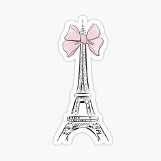 the eiffel tower with a pink bow sticker on it's side