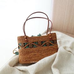 Kokonut Handwoven Rattan Handbag Bali – Lokatan Eco-friendly Brown Shoulder Bag For Vacation, Brown Shoulder Satchel For Vacation, Brown Straw Shoulder Bag For Vacation, Brown Shoulder Bag With Braided Handles For Vacation, Rectangular Light Brown Beach Bag For Travel, Brown Large Capacity Satchel For Vacation, Brown Satchel With Large Capacity For Vacation, Bohemian Brown Straw Bag With Large Capacity, Bohemian Light Brown Rectangular Bag