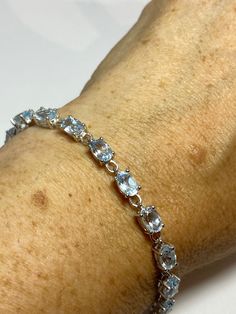 Vintage Blue Aquamarine 925 Sterling Silver Tennis Bracelet https://www.etsy.com/listing/1263415020/vintage-blue-aquamarine-925-sterling?utm_source=crowdfire&utm_medium=api&utm_campaign=api Elegant Silver Bracelet With Blue Topaz, Elegant White Gold Bracelet With Blue Topaz, Elegant Adjustable Blue Topaz Bracelets, Sterling Silver Gemstone Tennis Bracelet, Sapphire Sterling Silver Bracelet, Wedding Bracelets With Blue Topaz Gemstones, Blue Topaz Gemstone Bracelets For Wedding, Luxury Silver Bracelet With Blue Topaz, Luxury Silver Bracelets With Blue Topaz