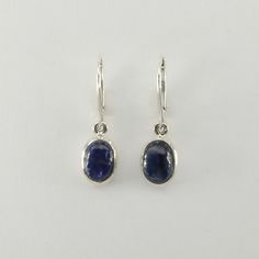 This is a  beautiful pair of Blue Kyanite Earrings in 925 Sterling Silver. They are made out of Sterling Silver with no nickel so there should be no allergic reaction and nothing will turn green. The silver is not only silver plated or steel but solid 925 Sterling Silver. We usually ship the same day in a nice gift box. Oval Sterling Silver Earrings With Polished Finish, Oval Sterling Silver Jewelry With Ear Wire, Blue Oval Cabochon Earrings As Gift, Blue Oval Cabochon Earrings For Gift, Classic Oval Earrings With Ear Wire, Classic Oval Sterling Silver Earrings, Sterling Silver Oval Earrings With Ear Wire, Nickel-free Oval Earrings For Anniversary, Sapphire Color Oval Sterling Silver Earrings