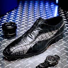 Beautiful genuine hornback and alligator oxford style dress shoes. Featuring hand painted combo color finish, fine stitch detailing, cushioned insole and leather lining. Full leather sole. Made in Italy. These lavish Italian-crafted shoes showcase a unique blend of style and comfort. Let the genuine hornback and alligator accents bring a sophisticated touch, while a cushioned insole and leather lining keep your feet supported all day. Add the perfect finishing touch to any look! This product is Leather Oxfords With Crocodile Pattern And Pointed Toe, Black Crocodile Pattern Oxfords For Business, Black Crocodile Pattern Wingtip Oxfords, Business Dress Shoes With Crocodile Pattern, Fitted Black Dress Shoes With Crocodile Pattern, Semi-formal Leather Oxfords With Crocodile Pattern, Formal Crocodile Pattern Cap Toe Dress Shoes, Formal Cap Toe Dress Shoes With Crocodile Pattern, Leather Wingtip Oxfords With Crocodile Pattern