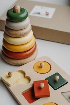 a wooden toy stacking up on top of a table