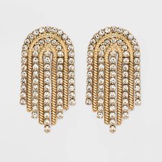 Add a little edge and sparkle to every ensemble with the SUGARFIX by BaubleBar Crystal and Gold Arch Statement Earrings. These statement earrings feature on trend curtain fringe crafted from gold hardware, and are dotted with dainty crystals for extra shine. With its unique shape and sleek movement, we're sure you'll wear this pair for many occasions. Disco Outfits, Glowforge Projects, Beige Fashion, Baublebar Earrings, Curtain Fringe, Rhinestone Fringe, Bead Embroidery Tutorial, Fairy Jewelry, Preppy Dresses