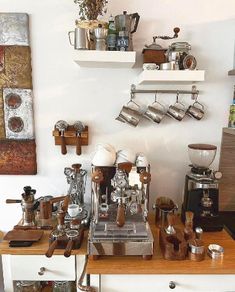 a coffee machine sitting on top of a wooden counter