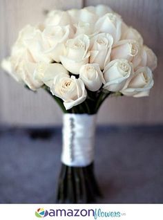 a bouquet of white roses in a vase