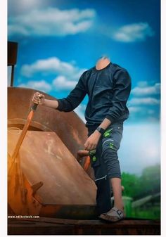 a man standing on top of a wooden boat