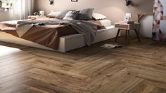 a bed sitting on top of a hard wood floor next to a wall mounted clock