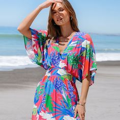 Embrace weekend vibes in the Bright Tropical Smocked Maxi Dress. Perfect for brunch with friends or a family gathering, its easy-going style and bright print make every day feel like a getaway. Whether you're attending a garden party or enjoying a beachside dinner, this versatile dress is your go-to choice for any warm-weather occasion. Product code: CAA05A4D165EE Green Beach Dress With Elastic Waistband, Beachy Short Sleeve Beach Dress For Brunch, Summer Brunch Dress With Elastic Waistband, Multicolor Smocked Back Dress For Summer, Multicolor Summer Dress With Smocked Back, Casual Vibrant Print Dress For Brunch, Casual Brunch Dress With Vibrant Print, Casual Dresses With Vibrant Print For Brunch, Casual Multicolor Print Dress For Beach Party