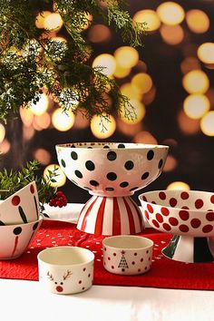 a table topped with bowls and plates covered in polka dots