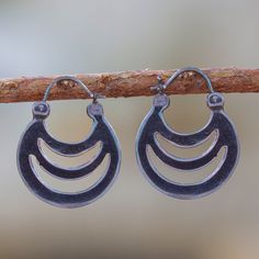 Evoking the shadows of crescents, elegant openwork details these hoop earrings from Mexico. Martha Vargas creates these earrings, which are crafted from sterling silver with a combination of finishes. Crescent Oxidized Sterling Silver Earrings, Crescent Hoop Earrings With Ear Wire, Adjustable Crescent Hoop Earrings, Metal Crescent Hoop Earrings, Nickel-free Crescent Jewelry, Adjustable Crescent Sterling Silver Hoop Earrings, Silver Crescent Hoop Earrings With Ear Wire, Sterling Silver Crescent Hoop Earrings, Crescent Shape