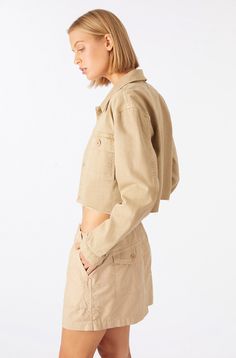 A cropped version of the classic utility jacket, with a collar at the neckline, front patch and flap pockets, and finished with a raw hem for a lived-in look. Made from a perfect mix of cotton and lyocell, the result is a super comfortable all-season fabric. COLOR: KHAKI FIT & MEASUREMENTS: Length = 19 1/4" Chest = 39 1/2" Measurements taken from size Small Anaiis is wearing size S and is 5'11" FABRIC & CARE: 70% Cotton, 29% Lyocell, 1% Elastane Machine Wash Cold. Made with love in Los Angeles Workwear Jacket, Wool Shirt, Cropped Denim Jacket, Denim Jacket Women, Corduroy Jacket, Women's Coats & Jackets, Twill Fabric, Cropped Denim, Knit Jacket