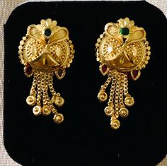 Indian dangling earrings are a traditional and iconic style of jewelry that originate from India and are popular throughout the Indian subcontinent. These earrings are known for their distinctive design, They are a significant part of Indian culture and are worn by women on various occasions, including weddings, festivals, and other celebrations. These earrings are for pierced ears.  Size:  1 inch Note: these earrings are for pierced ears only Occasions: Indian earrings are versatile and can be worn on various occasions, from everyday wear to special events like weddings, festivals, and other celebrations. Care: wipe with clean dry cloth Festive 22k Gold Drop Earrings, 22k Gold Latkan Earrings For Celebrations, Festive 22k Gold Earrings, Festive 22k Gold Traditional Earrings, Festive Traditional 22k Gold Earrings, Filigree Earrings As Diwali Gift, Filigree Earrings For Diwali Gift, Filigree Earrings As Gift For Diwali, Filigree Earrings Gift For Diwali