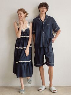 Couple pajamas set in soft cotton fabric. Man's contrast piped trimming short-sleeved shirt with a resort collar, buttons at front, gently dropped shoulders, and an open chest pocket. Shorts with covered elastic at waistband. Woman's nightgown in calf-length, lace-trimmed sweetheart neckline and shoulder straps, and gathered tiers. Unlined.- Couple pajamas- A-line- Midi- Sleeveless Summer Pajama Party Sleepwear With Pockets, Summer Nightgown For Pajama Party With Relaxed Fit, Relaxed Fit Summer Nightgown For Pajama Party, Summer Pajama Shorts With Pockets For Pajama Party, Collared Sleepwear With Pockets For Loungewear, Summer Cotton Sleepwear With Camp Collar, Blue Summer Sleepwear For Home, Summer Short Sleeve Nightgown For Pajama Party, Blue Summer Sleepwear With Pockets