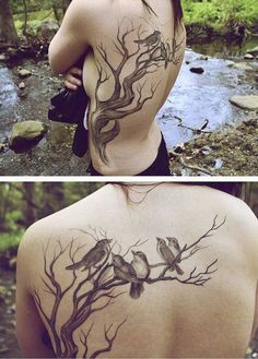 the back of a woman's body with birds on it