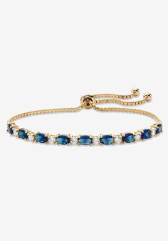 Color the day with classic style and vibrant color with this beautiful slider bracelet. Glimmering simulated blue sapphires and sparkling cubic zirconia ovals alternate on the adjustable bolo strand featuring ball ends that dangle in cool style. 6.20 carats T.W. 10" length. Richly plated in 14k yellow gold.14k Gold-PlatedMain Stone: 9 Oval Faceted Cut Simulated Blue Sapphires, 5.40 carats total weight, 6 mm x 4 mm8 Round Brilliant Cut Cubic Zirconias, .80 carat total weight, 3 mm x 3 mmDimension Gold And Blue Bracelet, Adjustable Sapphire Bracelets For Formal Events, Adjustable Sapphire Bracelets For Formal Occasions, Blue And Gold Bracelets, Adjustable Blue Round Tennis Bracelet, Adjustable Blue Tennis Bracelet, Gold And Blue Jewelry, Blue Wedding Bracelet, Blue And Gold Jewelry