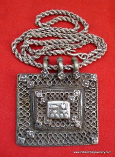 VINTAGE ANTIQUE COLLECTIBLE TRIBAL OLD SILVER PENDANT WITH CHAIN NECKLACE FROM RAJASTHAN INDIA. NICE HANDMADE DESIGN GREAT PIECE FOR ETHNIC JEWELRY COLLECTOR OR FOR TRIBAL STYLE BELLY DANCE. SUBJECT OF THIS AMULET IS HINDU GODDESS LAXMI (GODDES OF WELTH) AND LORD GANESHA (GOD OF MIND AND LUCK).Note - god image is much worn see picture carefully for more detail.chain Length - 60 cm(23.6")we can adjust the length.Pendant size - 7.5/6.8 cm(2.95/2.67")Weight - 100.5 gramsMaterial - Good silver & Traditional Engraved Temple Necklace For Rituals, Silver Ceremonial Jewelry For Festivals, Ceremonial Silver Jewelry For Festivals, Silver Jewelry For Ceremonial Festivals, Silver Locket Necklace For Festival, Engraved Jewelry For Festivals, Traditional Silver Jewelry For Festivals, Antique Silver Jewelry For Ceremonial Occasions, Antique Silver Jewelry For Ceremonies