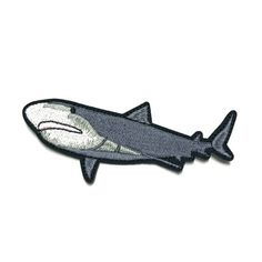 a gray shark embroidered on a white background