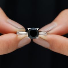 Product Details Look stylish while flaunting this Black Spinel Solitaire Ring adorned with a Cushion Shape Black Spinel in 4 prong setting while a hidden Round Shape Diamond graces its shank in bezel setting. Gift this stunning Solitaire Ring crafted in Solid Gold to your better half on a special day and win her heart right away. Product Information SKU SHP-RINGS122040919 Width 7 mm Height 8.5 mm Weight 2.64 gm (Approximate) BLACK SPINEL INFORMATION No.of Stones 1 Pieces Total Weight 2.10 Carat Black 14k Gold Rings With Prong Setting, Classic Black Onyx Diamond Ring, Black Solitaire Ring Fine Jewelry, Black Solitaire Ring, Fine Jewelry, Black Diamond Ring In 14k Gold, Round Cut, Better Half, Ring Crafts, Black Spinel, Look Stylish