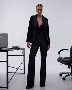 Three-piece pantsuit for women: straight leg pants with high rise, buttoned vest and lined blazer with satin lapel collar Please note suit measurements  Pants length inseam is 35.4 inches or 90 cm Pants length from waist 44 inches or 112 cm Sleeve length 24.4 inches or 62 cm Blazer length along the back 25 1/2 inches or 65 cm Vest length along the back 17.7 inches or 45 cm Our Women's Blazer Trouser Suit for office, business meetings, formal events and special occasions. Always trendy, classic and o good looking DETAILS -  straight leg pants -  high rise -  blazer is buttoned -  lined -  side pockets -  relaxed fit -  single breasted -  buttoned vest MATERIAL Premium quality suiting fabric, consists of viscose, elastane and polyester  SIZES The model in photos is wearing a size S Available Fall Workwear Suits With Straight Leg, Business Casual Tuxedo Pantsuit With Notch Lapel, Chic Tailored Pantsuit With Suit Collar, Fall Tuxedo Style Workwear Pants, Tailored Sleek Pantsuit With Suit Collar, Business Casual Tuxedo Pantsuit With Suit Collar, Fitted Straight Leg Outerwear For Business Casual, Sleek Tailored Pantsuit With Notch Lapel, Sleek Tailored Pantsuit With Suit Collar