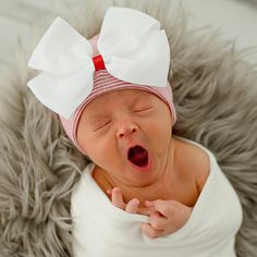 Are you having a Christmas Newborn Girl? This is a beautiful classic red & white striped newborn hat with a handmade white bow with a red center.  This beautiful newborn nursery hat provides warmth and style! This newborn girl is made with authentic hospital hat material. This Christmas Scalloped Ribbon Bow Newborn Hospital Hat is also made with a 2-ply fabric for additional warmth and comfort and this hat is 100% authentic hospital-grade material. This newborn girl hat is extremely soft and super stretchable providing the ultimate comfort to your little princess. This is a wonderful hat for a CHRISTMAS baby. White Bonnet Gift, One Size Fits Most, White Bonnet Gift (one Size Fits Most), White Bonnet, One Size Fits Most, Gift, Cute White Hat With Bow, Cute White Hats With Bow, Adjustable White Hat With Bow, White Christmas Hat As Gift, Cute Red Hat For Gift, Cute Red Hat As Gift