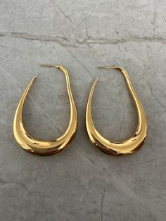 The Oblong earring is perfect for any occasion. It can be worn to make a statement or is also great for daily wear. Measurements: Height: 5.96cmWidth: 3.89cm Good Accessories, Gold Earrings Aesthetic, Good Earrings, Gold Statement Jewelry, Funky Earrings, Fancy Jewellery, Jewelry Essentials, Handmade Wire Jewelry