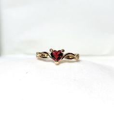 18k Yellow Gold Heart Shaped Ruby July Birthstone Delicate Dainty Ring Size 7 18k Yellow Gold Plated This Ring Is True To Its Beauty!!! The Detail And Sheer Sparkle Is Absolutely Stunning!! Wear Your Heart On Your Finger, Or Gift This To The Love Of Your Life! This Heart Shaped Solitaire Gemstone Sits Pretty On A 18k Yellow Gold Plated Band. This Lab Created Ruby Is A Shiny Red Gem Teeming With Fire And Brilliance. #Goldplated #Ringsize7 #Size7ring #Julybirthstone #Ruby Red Fashion Gold Plated H Heart Shaped Gold Ring, Gold Red Heart Earrings, Gold And Red Wedding Ring, Gold Ring Ruby, Red Gold Ring, Gold Promise Rings For Couples, Gold Ring Red Stone, Gold Plated Promise Ring For Valentine's Day, Gold Ruby Ring With Accent Stones For Promise