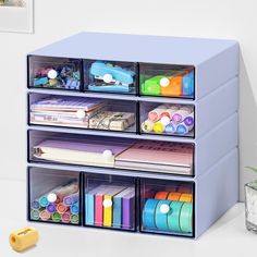 the drawers are filled with different types of crafting supplies and storage bins on top of each other