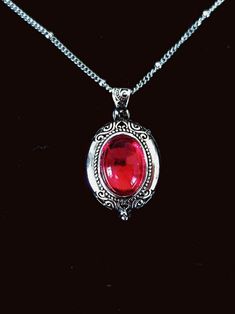 Vintage Style Silver Oval Ruby Locket Victorian Jewellery Red - Etsy Antique Engraved Red Jewelry, Red Engraved Antique Jewelry, Antique Silver Necklace With Vintage Charm, Red Pendant Necklace With Vintage Charm, Antique Silver Oval Necklace With Vintage Charm, Antique Silver Necklaces With Oval Vintage Charm, Elegant Red Locket Necklaces, Red Victorian Engraved Jewelry, Antique Silver Necklace With Vintage Charm In Oval Shape