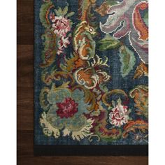 an area rug with flowers and leaves on it