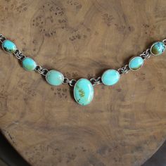 If you are a lover of natural turquoise, this is the natural, turquoise necklace you've been waiting for. 7 cabochons of natural, gorgeous, old-stock Hubei Turquoise. Brand new in the LBJ lineup, this listing is for the multi-stone turquoise necklace in the photos. Such a great-looking and feeling necklace. Dressy and casual at the same time, this turquoise necklace is so easy to wear you may forget you have it on. Set in oxidized and polished, .925 Sterling Silver setting from integrated .925 S Turquoise Oval Natural Stones Necklaces, Artisan Turquoise Oval Necklace, Oval Turquoise Natural Stone Necklaces, Turquoise Necklaces With Oval Natural Stones, Turquoise Oval Necklaces With Natural Stones, Oval Turquoise Necklaces With Natural Stones, Artisan Untreated Turquoise Necklace, Unique Turquoise Cabochon Necklace, Handmade Chrysoprase Turquoise Necklace