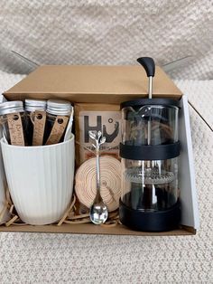 an open box containing coffee and utensils