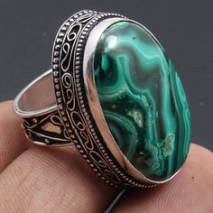 Malachite Gemstone Ring Jewelry Gift For Him Vintage Style Ring Handmade Jewelry Ring Jewelry Gift For Her Materials  Sterling Silver Plated Ring US Size  9.5 Stone Name  Malachite Stone Color  Green Shipping Policy We do ship through DHL, UPS, INDIA POST.  The rest of the Ring is made from 925 Sterling silver Plated 92.5% pure silver Plated . And it doesn't have any lead or nickel. I make more than 50 different gemstones. If you want other gemstones, Please inbox me. I'll show you the pictures before you buy. We will move forward only when you are satisfied. I can also make the ring in: Silver plated All kinds of customizations can be done. Try to keep it away from water. If it comes in contact of water then clean with a dry cotton cloth ASAP for the polish to stay longer. All shipping is Handmade Jewelry Ring, Vintage Style Rings, Malachite Stone, India Post, Plated Ring, Jewelry Ring, Ring Sterling Silver, Ring Jewelry, Ring Handmade