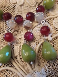 "One strand beaded neckkace made with 18mm long and 12mm wide jade, and inlaid 12mm crystal inlaid jasper. The burgandy jasper is 10mm. This stunning necklace is 18 3/4\" long. Great fall colors. The stones have a beautiful luster and are faceted with the exception of the inlaid jasper." Elegant Faceted Jade Necklaces, Costume Jewelry With Faceted Dangle Beads, Jade Gemstone Beads Pendant Jewelry, Jade Gemstone Beads Pendant, Jade Pendant With Gemstone Beads, Elegant Faceted Jade Beaded Necklaces, Elegant Faceted Jade Beaded Necklace, Artisan Jewelry With Faceted Beads And Dangle Design, Artisan Jewelry With Faceted Bead Dangles