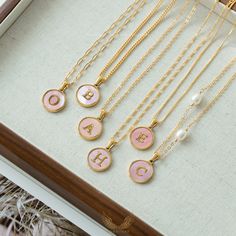 Introducing our Personalized gold-Filled pink mother of Pearl Initial Necklace. These stunning pieces combine the timeless elegance of mother of pearl with the personal touch of a customizable initial pendant. Plus, you can choose from six versatile chain options to suit your style and preferences.These wonderful pieces of jewelry will make a sweet, thoughtful, and precious gift for yourself or that special someone. Product Details Chain: -Gold-filled Curb Chain   Width: 2mm -Gold-filled Box Cha Elegant Pink Initial Pendant Necklaces, Personalized Pink Charm Necklace As Gift, Personalized Pink Charm Necklace With Pendant, Personalized Pink Pendant Charm Necklaces, Handmade Pink Charm Necklaces For Mother's Day, Personalized Pink Pendant Charm Necklace, Handmade Pink Charm Necklace For Mother's Day, Elegant Personalized Pink Charm Necklace, Pink Pearl Charm Jewelry Gift