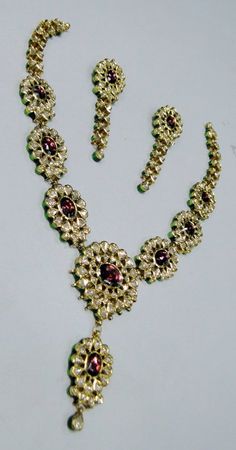 "Vintage 22K solid gold, Old cut Diamonds set with multicolor Enamel work necklace (Kundan Meena choker)with Matching Earrings. A nice old design from the 60s with old cut diamonds. A solid piece of jewelry set with color stones great workmanship. Length of necklace -28 cm (11.02\") Size could be adjusted according to your requirement by adding an adjustable cord. The width of Centerpiece-7 cm (2.75\"), the total weight of set -100.860 Grams (3.55 ounce). Length of earrings-6.5 cm,width of earri Yellow Gold Kundan Necklace For Diwali, 22k Gold Kundan Necklace For Diwali, Yellow Gold Kundan Necklace For Festivals, Festival Yellow Gold Kundan Necklace, Yellow Gold Kundan Necklace With Meenakari For Puja, 22k Gold Meenakari Bridal Necklace, 22k Gold Bridal Necklace With Meenakari, Hand Set Round Kundan Necklace For Diwali, Yellow Gold Meenakari Jewelry Sets For Diwali