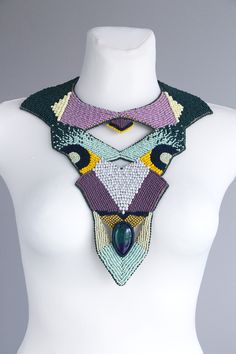 One of a kind multicolor statement necklace. Large collar necklace made only of seed bead and natural multicolor gemstone. The shape and colors of the stone can be slightly different. This is big and bold bead embroidery necklace design, but it is not very heavy at all. Necklace neck size is adjustable for each neck size. The back side of necklace is animal friendly Italian fabric, gentle to your skin. Statement necklace made mostly of mate seed beads color. Colorful and large body necklace desi Artisan Multicolor Beaded Crystal Necklace, Artisan Multicolor Crystal Necklace With Colorful Beads, Artisan Multicolor Crystal Necklace, Unique Bib Necklace With Large Beads For Jewelry Making, Unique Multicolor Crystal Necklaces With Colorful Beads, Multicolor Gemstone Beads For Party, Unique Multicolor Crystal Necklaces, Artisan Handmade Multicolor Crystal Necklaces, Bohemian Multicolor Beaded Beads Gems And Cabochons