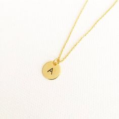 "initial necklace, hand stamped necklace, initial jewellery, personalised necklace, minimalist necklace, monogram necklace, gifts for her \"Less is more\" - Minimalist hand stamped 10mm gold, silver or rose gold plated initial disc - You can choose any letter from initials section to personalize it - Plated chain comes 16inch. Please send me message if you would like it 18inches. This beauty comes inside in a gift box. If your order is a gift, I would be happy to include a personal note for you. Gold Name Necklace For Christmas Birthday Gift, Yellow Gold Initial Necklace For Birthday, Gold Jewelry For Christmas Birthday Gift, Simple Gold Charm Necklace For Valentine's Day, Adjustable Gold Necklaces With Hallmark, Dainty Pendant Charm Necklace, Adjustable Gold Necklace With Hallmark, Adjustable Gold Initial Necklace For Personalized Gift, Personalized Gold Name Necklace For Christmas