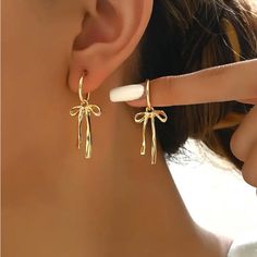 Coquette Bow Dangle Drop Earrings Coquette Bow Jewelry Trendy Bow Earrings Gold. 14k Gold Plated Tassel Bow Earrings, Dangle Bow Drop Earrings. **Smoke Free Home Bow Tie Earrings, Classy Jewelry Earrings, Old Money Earrings Aesthetic, Silver Bow Earrings, Girl Hood, Bow Earring, Jewelry Gold Earrings, Jewellery Aesthetic, Wishlist Ideas