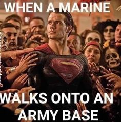 a man in a superman suit surrounded by people with words that read, when a marine walks onto an army base