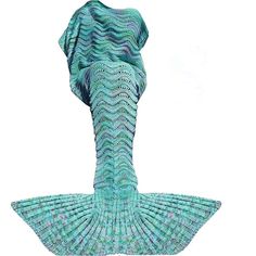 a woman wearing a blue knitted mermaid tail