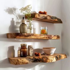 two wooden shelves with jars and vases on them