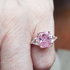 Beautiful Pink Radiant Fancy Cut 3 Carat Cz Center Flanked By 2 Half Carat Fancy Trillion Stones. Cz's Set In 10kt And Size 5. Total Carat Weight Is 4ct. Stunning!! Nwot Luxury Gia Certified Pink Sapphire Diamond Ring, Pink Gia Certified Diamond Ring For Formal Occasions, Elegant Gia Certified Pink Sapphire Diamond Ring, Formal Pink Gia Certified Diamond Ring, Gia Certified Fine Jewelry Pink Sapphire Diamond Ring, Fine Jewelry Gia Certified Pink Sapphire Diamond Ring, Gia Certified Pink Sapphire Diamond Ring In Fine Jewelry, Gia Certified Pink Sapphire Diamond Ring, Luxury Pink Diamond Ring For Formal Occasions