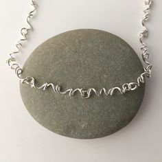 This necklace is made from sterling silver. It has a lobster claw clasp. Each spiral link is individually created for a pleasing organic feeling. The spiral links are connected with soldered silver jump rings. Please select the length you would prefer. I can make other lengths as custom orders. This is the necklace that I wear every day. It works well with anything from jeans and a t shirt to and little black dress. The necklace will be shipped in a decorative cardboard jewelry box filled with a Twisted Necklace, Choker Necklace Silver, Cardboard Jewelry, Choker Silver, Spiral Necklace, Hammered Bangles, Small Gold Hoops, Handmade Chain, Tiny Hoop Earrings