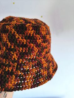 Handmade crochet bucket hat in soft acrylic yarn in brown beige green and gold colours. Comfy and keeps warm. Product size: 55-59см head girth.  Before ordering, please make sure that this item is the right size for you. Color: beige pink blue gold ( color discrepancies may occur due to different screen settings). Gender: unisex. Suitable for seasons: warm winter, spring and autumn. Material: acrylic yarn. Product care- machine washable, cool wash-30o, do not iron, do not tumble dry, do not Brown Bucket Hat For Fall, Brown Crochet Hat With Curved Brim For Outdoor, Brown Curved Brim Crochet Hat For Outdoor, Brown Bucket Hat For Fall, One Size Fits Most, Outdoor Brown Crochet Hat With Curved Brim, Casual Brown Crochet Hat For Festival, Adjustable Handmade Brown Cloche Hat, Brown Hand-knitted Crochet Hat For Beach, Hand Knitted Brown Hats For Beach