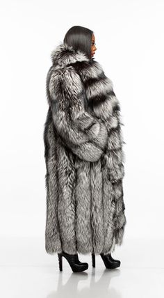 Now this is a coat! Our stunning Fancy full length coat with detachable sleeves is made of the highest quality full skin silver fox fur. Zip off the fabulous sleeves to sport a Fancy vest. This coat features hook closure and pockets. The Fancy coats runs large. Please order one size down from your normal size. Model is 5'5'', 160lbs, 36G bust, 29 inch waist, 43" hips and is wearing a size M. Big Fur Coat, Snow Tiger, Fabulous Fox, Fox Coat, Girls Fur, Full Length Coat, Fur Cape, Fabulous Furs, Fur Hood Coat