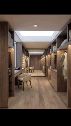 an empty walk - in closet with wooden floors