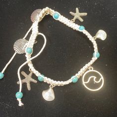 Cute Adjustable Bracelet Is Made With Seashell And Starfish Charms. Perfect Gift For Any Ocean Lover. Adjustable Coastal Style Bracelet Jewelry, Coastal Style Adjustable Bracelet Jewelry, Coastal Adjustable Jewelry For Beach Season, Adjustable Coastal Jewelry For Beach Season, Nickel-free Sterling Silver Friendship Bracelets, Bohemian Silver Jewelry For Vacation, Beach Charm Bracelet With Lobster Clasp, Adjustable Silver Bracelets With Ocean-inspired Style, Adjustable Silver Bracelet With Ocean-inspired Style