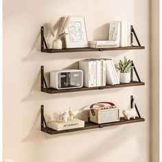 two shelves with books and other items on them