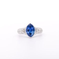 This is part of Chairish’s Fine Jewelry assortment.  GIA Certified Vintage Sapphire and Diamond Platinum Ring. Ideal as a man's pinky ring or a woman's statement/engagement ring.   This timeless ring features a marquise-cut blue Sapphire originating from Sri Lanka, it weighs 4 carats, and is of Sri Lanka (Ceylon) origin. It is paired with two cuts of diamond detailing, totaling 1.65 carats. The gemstones are set in a prong or bezel setting, ensuring the secure placement of the piece. The ring is Gia Certified Marquise Platinum Rings, Marquise Sapphire Ring In White Gold With Vvs Clarity, Elegant Gia Certified Trillion Cut Ring, White Gold Marquise Sapphire Ring With Vvs Clarity, Marquise White Gold Sapphire Ring With Vvs Clarity, Gia Certified Platinum Marquise Rings, Gia Certified Trillion Cut Formal Rings, Formal Gia Certified Trillion Cut Ring, Fine Jewelry Marquise Cut Ring With Bezel Setting